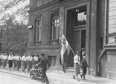 Students marching in front of the Institut für Sexualwissenschaft prior to pillaging it. May 6, 1933.  